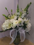 Hydreangeas, roses, snapdragons, alstroemeria, asiatic lillies, and greens