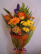 Rose, daisies, iris, alstroemeria, gerbera, and solidago