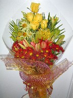 Roses, protea, lillies, daisies, solidago, and leucadendron