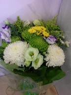Commercial mums, lisianthus, spider mums, viking daisies, solidago, and statice