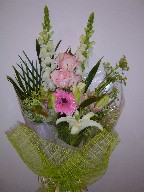 Snapdragon, roses, lillies, Queen Anne's lace, and teepee