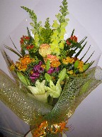 Snapdragon, roses, daisies, lillies, and alstroemeria