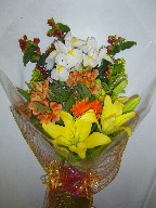 Iris, lillies, gerbera, alstroemeria, solidago, and coffee beans