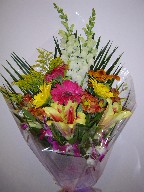 Snapdragon, gerbera, shocking lillies, dendrobium orchids, solidago, alstroemeria, pompoms, and teepee