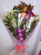 Dendrobium orchids, roses, coffee beans, gerbera, alstroemeria, and statice