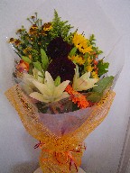 Dahlia, lillies, roses, sunflowers, daisies, berries, and solidago