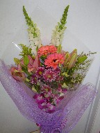 Dendrobium orchids, lillies, gerbera, snapdragon, solidago, and waxflowers