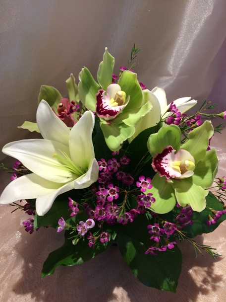 Cymbidium orchids, asiatic lilies, and waxflowers