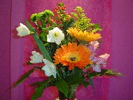 Daffodils, gerbera, alstroemeria, coffe beans, and pompoms