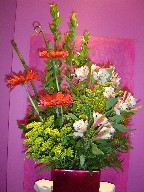 Gerbera, monkey grass, myrtle, alstroemeria, and solidago