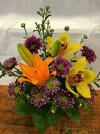Cymbidium orchid, asiatic lillies, and pompoms