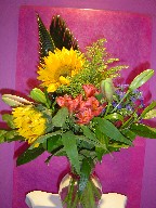 Sunflowers, lillies, alstroemeria, monte casino blue, and solidago