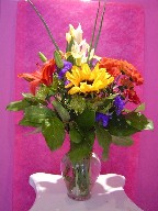 Iris, lillies, daisies, sunflowers, and statice