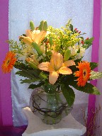 Lillies, alstroemeria, solidago, gerbera, and coffee beans