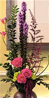 Roses, liatris, freesia and amaranthus in a vase