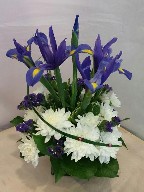 Iris, statice, crysanthemums, monkey grass and variegated pitt