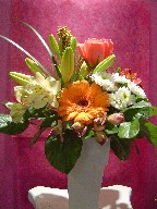 Gerbera, roses, spiderman, alstroemeria, pompoms, and lillies
