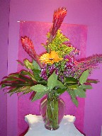Ginger, gerbera, solidago, heather, daisies, and monstera