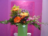 Orchids, solidago, gerbera, and casino blue