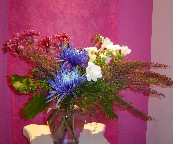 Spider mum, heather, freesia, and daisies