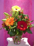 Gerbera, coffee beans, alstroemeria, solidago, and lillies