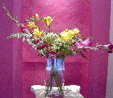 Freesia, waxflowers, and orchids