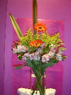 Gerbera, alstroemeria, solidago, and phormium