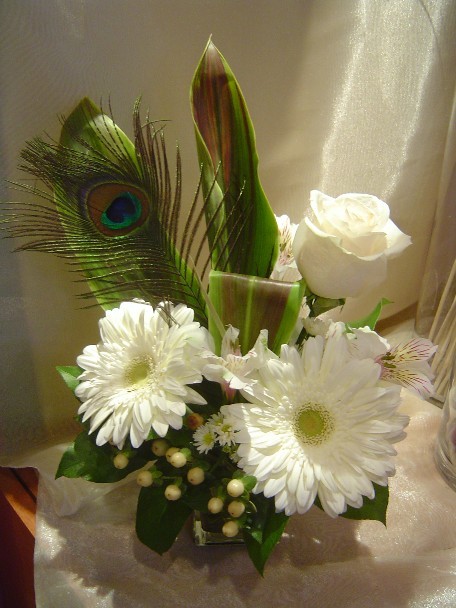 Gerbera, rose, alstroemeria, hypericum, and cordeline