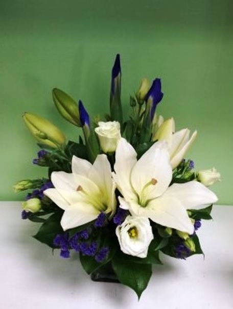 Iris, asiatic lilies, lisianthus, and statice