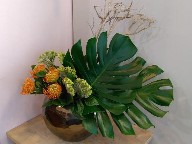 Protea, celosia, monstera, and branch