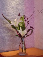 Lilies, kangaroo paw, aspedistra, and branch