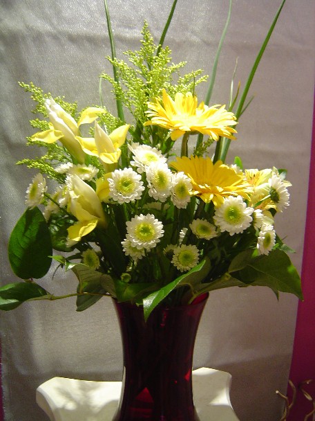 Gerbera, solidago, iris, and pompoms