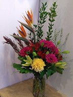 Gerbera, commercial mum, asiatic lillies, leucadendron, alstroemeria, myrtle, and thlaspia