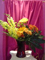 Snapdragon, gerbera, daisies, pompoms, and fatsia