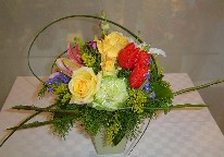 Solidago, asiatic lillies, casablanca, tulips, gold roses, and statice