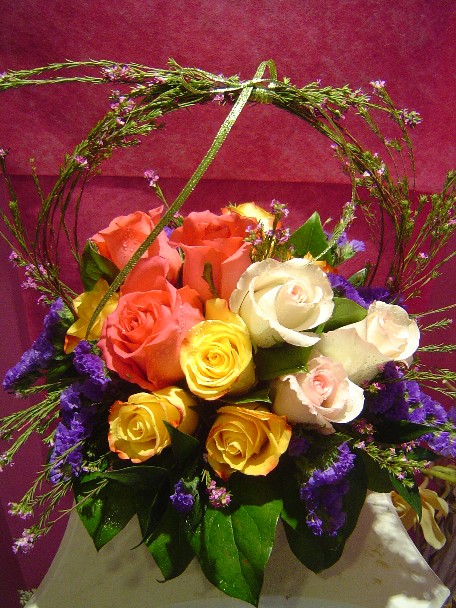 Roses, statice, and waxflowers