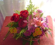 Solidago, daisies, red roses, and orange lillies