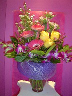 Roses, bouvardia, monte casino white, waxflowers, orchids, and gerbera