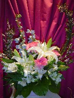 Lillies, roses, delphinium, thryptomene, alstroemeria, and dasies