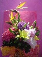 Bird of paradise, hydreangea, lillies, peonies, allium, and coffee beans