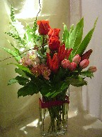 Roses, tulips, lillies, alstroemeria, snapdragon, curly willow, and aspedestra