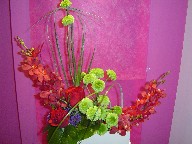 Roses, orchids, pompoms, and seafoam statice