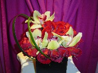 Roses (30), cymbidium orchids, and monkey grass