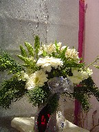Alstroemeria, Star of Bethlehem, dendrobium orchids, gerbera, pine, and Christmas branch