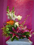Snapdragon, roses, gerbera, solidago, pompom, stargazer, and orchids