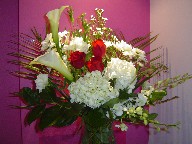 Calla lilies, hydreangea, lisanthus, roses, monte casino white, orchids, and daisies