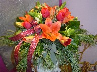 Tulips, lillies, Star of Bethlehem, green berries, pine, and seed eucalyptus