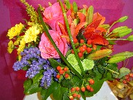 Roses, lillies, statice, coffee beans, solidago, dasies, and alstroemeria
