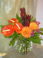 Anthurium, dahlia, eucadendron, alstroemeria, and cordeline