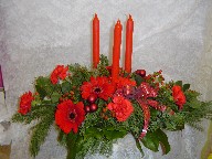 Gerbera, carnations, hypericum, pine, and Christmas decorations